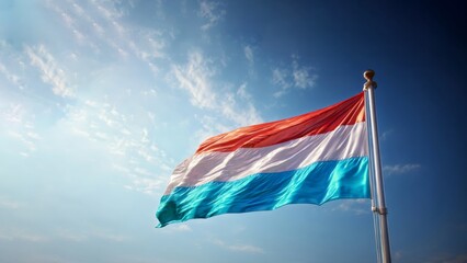 Celebrating luxembourg's independence day with the national flag under a clear blue sky