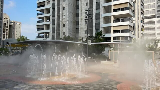 New buildings, green area around apartment buildings. Modern city in Israel.