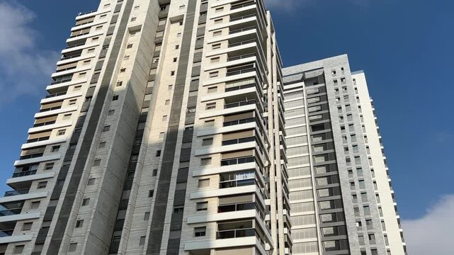 New buildings, green area around apartment buildings. Modern city in Israel.