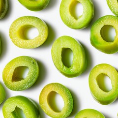 Close-up of fresh, sliced green olives, showcasing their vibrant color and texture. Perfect for culinary themes