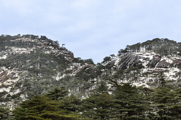 Sunset Lovers bridge against beautiful natural landscape with pine trees on granite mountain at Huangshan or Yellow Mountain, popular tourism landmark in China