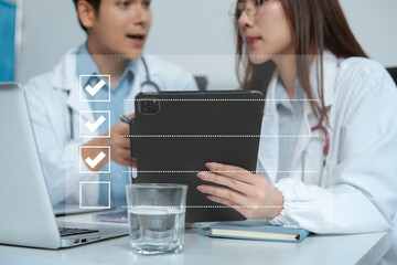 Doctor using tablet to do online checklist survey, doing assessment online survey answer test...