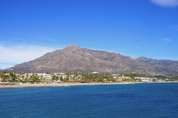 coast near Marbella and the Pico de la Concha mountain in beautiful light seen from the Mediterranean Sea, Marbella, Malaga, Costa del Sol, Spain