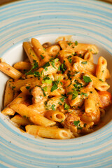 Creamy penne pasta with sausage and herbs