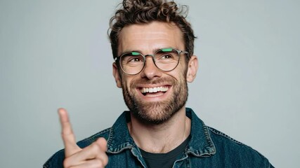 Smiling Handsome Man Gesturing to Empty Spot Beside Him