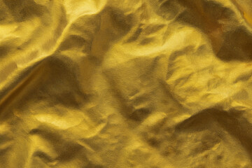 Gold Foil Texture Background – Wrinkled Metallic Surface with Shiny Golden Light Reflection – Luxury Material Design, Elegant Decorative Pattern