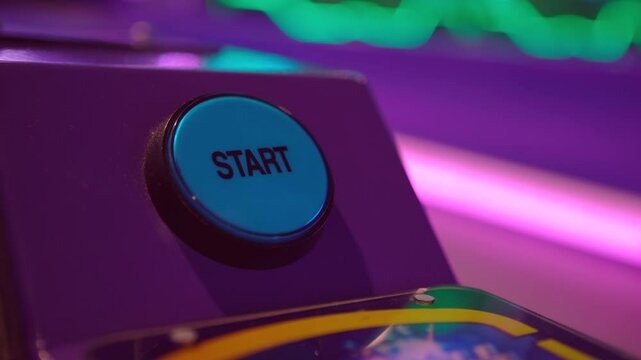Pressing START button on arcade ball game 4k

