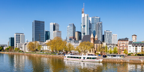 Frankfurt skyline skyscrapers with banks on River Main with excursion boat panorama in Frankfurt, Germany