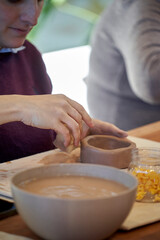 Shape clay with hands