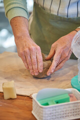Shape clay with hands