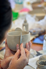 Shape clay with hands