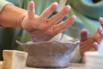 Shape clay with hands
