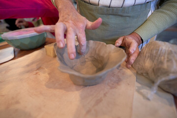 Shape clay with hands