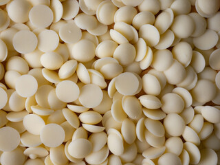 White chocolate chips Pistols buttons. Confection and pastry concept.