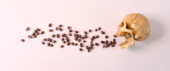 A human skull with roasted coffee beans .