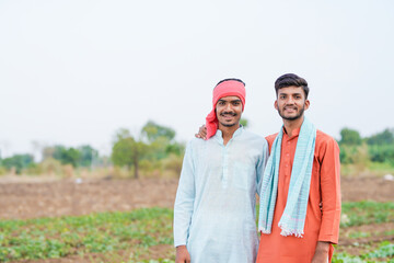 indian farmer standing together at agricultural field
