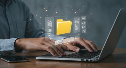 Person searching for files online using laptop computer