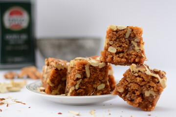 Akhroti Sohan halwa on a white background
