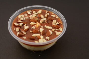 Chocolate pudding with some almonds on it