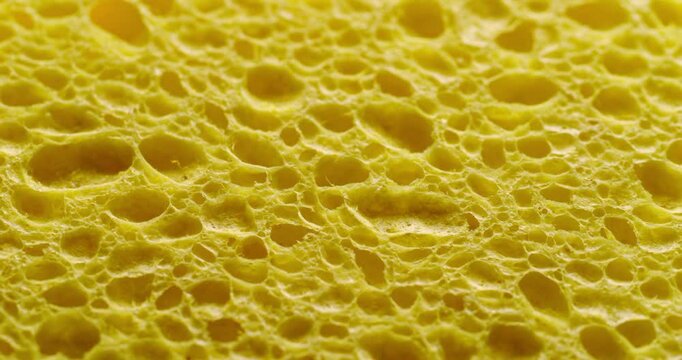 Seamless Rotating Yellow Sponge Texture Loop. Video featuring a smooth, rotating pattern of a vibrant green sponge texture with organic pores, ideal for dynamic design projects.	