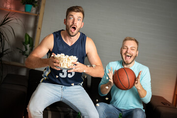 Excited fans watching a basketball game, facial expression