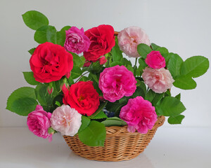 Colorful roses in a wicker basket