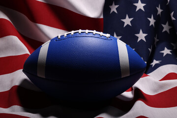 American football ball and USA flag. Sport game. Super bowl in US. Football ball Close Up macro photography with copy space.