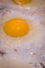 Eggs cooking in the frying pan for a good breakfast