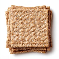 Stack of crispy whole wheat crackers, perfect for a healthy snack or light meal.  Close-up studio shot showing the texture and detail of the crackers. 