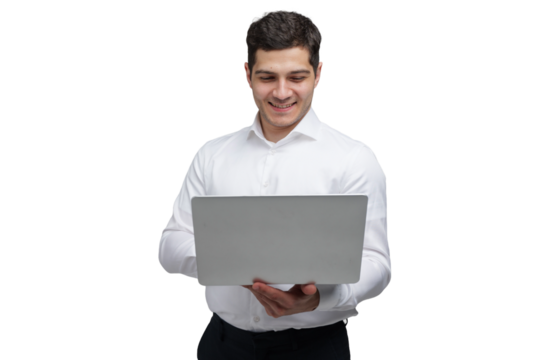 Young professional working on a laptop with a smile, showcasing the joy of technology