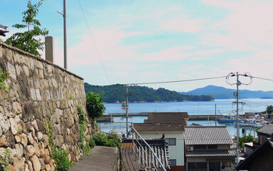 A small observatory platform beside the stone wall of the temple on the mountain.
The background is...