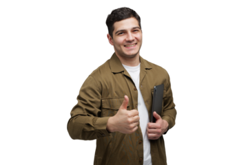 Smiling young man gives a thumbs-up while holding a laptop, showcasing confidence and positivity