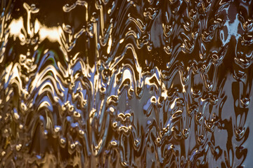 Liquid chocolate flowing down a wall.