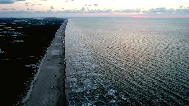 Aerial View of Coastal Highway Meeting the Ocean at Dawn
