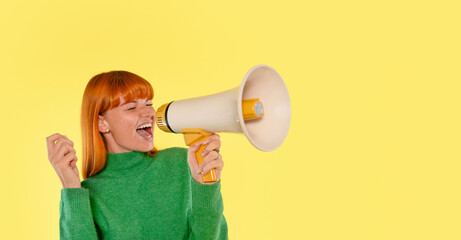 Brightly dressed woman enthusiastically uses a megaphone to amplify her voice against a vibrant...