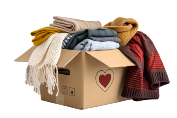 Cardboard box overflowing with warm clothing items PNG Image 