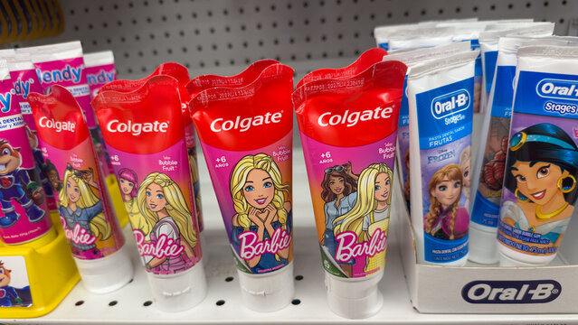 GUAYAQUIL, ECUADOR - JUN 19, 2025: Colgate and Oral-B children&rsquo;s toothpastes featuring Barbie, Frozen and Disney characters displayed on a supermarket shelf.