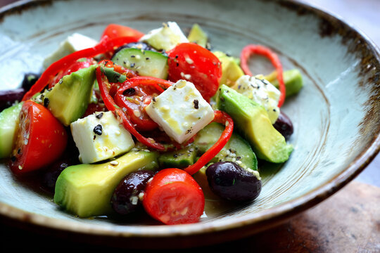 Classic Greek salad with Mexican avocado and spicy chili - Powered by Adobe