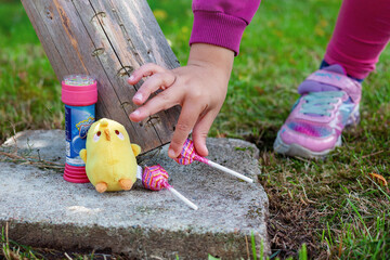 A childish composition of a little girl's belongings that she usually carries with her to the playground