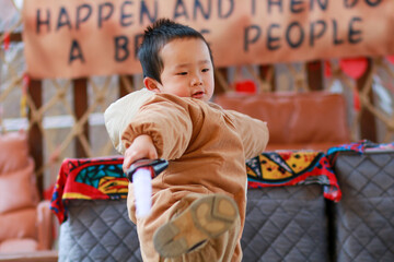 little boy with a toy sword
