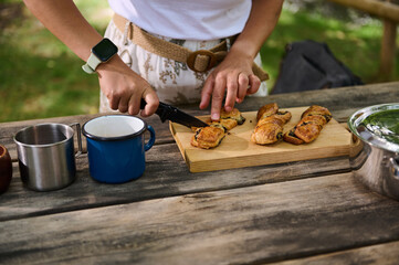 Preparing and Enjoying Delicious Pastries Outdoors on a Picnic Table
