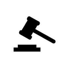 Black silhouette icon of a judge's gavel and sounding block representing law, justice, and authority on a white background