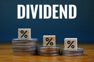 Financial Dividend Concept with Percentage Cube and Coins on Dark Blue Background