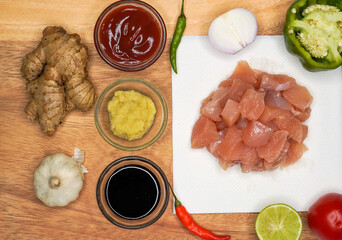 Top view preparation ingredients ( lime, chilies, onion, garlic, coriander root, galangal and lemon...