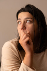 A young woman in the morning sun with blemishes. Illustrative photo for a cosmetic skin product.