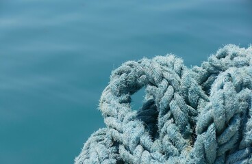 Blue rope for the boat by the sea nautical background