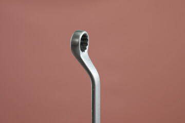 Offset ring spanner wrench on isolated background, mechanic tool concept
