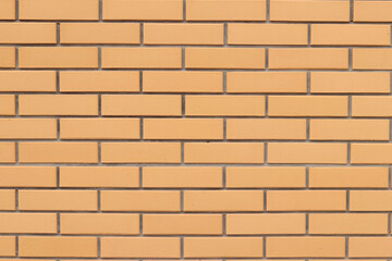 Brick wall texture, background. Orange brick wall background for exterior design. Construction concept, outdoor buildings, garage or house. Wall with classic checkerboard pattern and visible joints