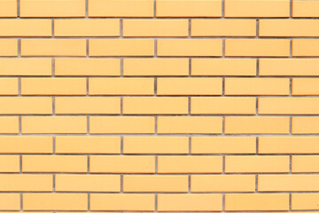 Brick wall texture, background. Orange brick wall background for exterior design. Construction concept, outdoor buildings, garage or house. Wall with classic checkerboard pattern and visible joints