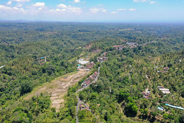 Obraz premium Panoramic Drone View of Forested Hills in Northern Bali
